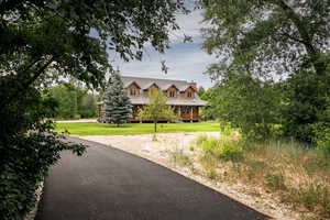 View of front of home featuring a front yard and a chimney