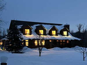 View of yard layered in snow