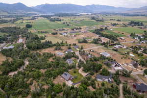 Aerial overview of property's location featuring rural landscape and a mountain backdrop