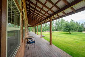 Deck featuring a lawn