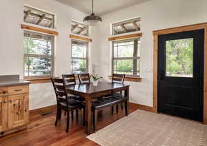 Dining room featuring wood finished floors and baseboards