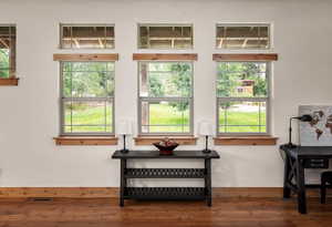 Detailed view of wood finished floors and baseboards