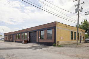 View of property featuring an attached garage