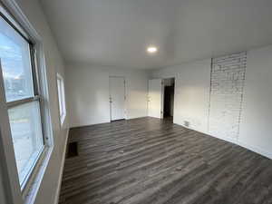 Spare room featuring dark wood finished floors and recessed lighting