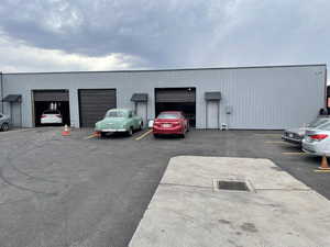 View of vehicle parking with a detached garage