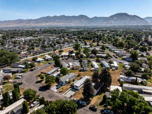 Aerial perspective of suburban area with a mountainous background
