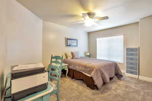 Bedroom with carpet floors and ceiling fan