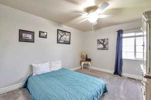 Bedroom featuring carpet floors and ceiling fan