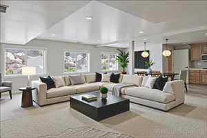 Living room with recessed lighting and light carpet