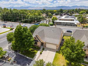 Aerial view of property and surrounding area featuring mountains