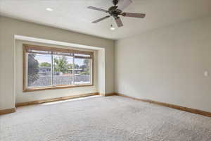 Carpeted spare room featuring recessed lighting and ceiling fan