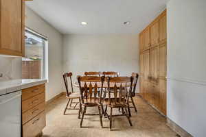 Dining area with recessed lighting and baseboards