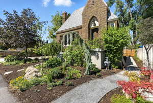 English style home with a chimney and a shingled roof