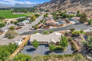 Aerial perspective of suburban area featuring a mountain backdrop