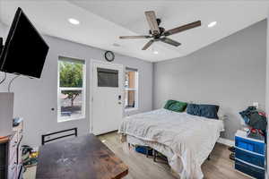 Bedroom featuring light wood-style floors, recessed lighting, and a ceiling fan
