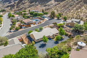 Aerial perspective of suburban area with a mountainous background