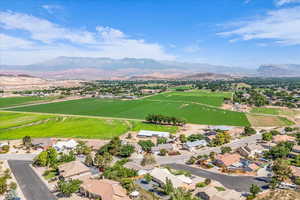 Aerial perspective of suburban area featuring a mountainous background