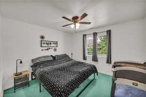 Bedroom with carpet floors and ceiling fan