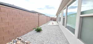 Fenced backyard with a patio