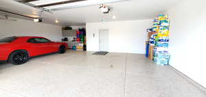 Garage featuring a garage door opener