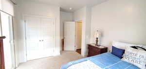 Bedroom featuring a closet and carpet flooring