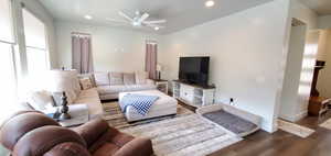Living area with ceiling fan, wood finished floors, and recessed lighting