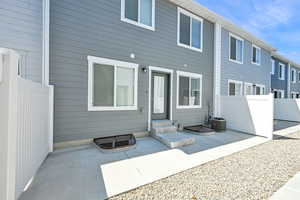 Rear view of property featuring a patio area and entry steps