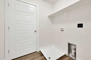 Laundry room featuring hookup for a washing machine, hookup for an electric dryer, and wood finished floors