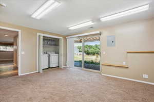 Apartment Bedroom with closets and laundry. Slider to outside