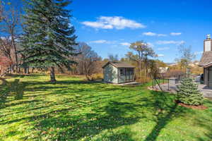 View of yard with a shed