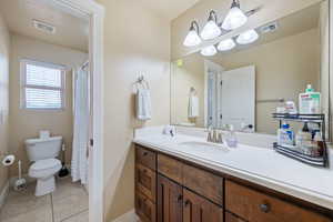 Bathroom featuring vanity and tile patterned floors