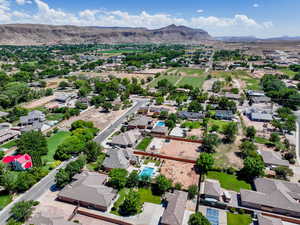 Aerial perspective of suburban area featuring a mountainous background