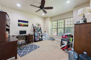 Home office with carpet flooring, ceiling fan, and recessed lighting
