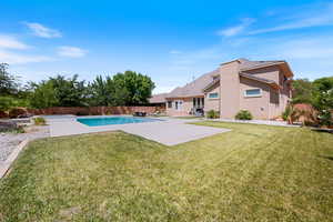 View of swimming pool with a fenced backyard and a patio area