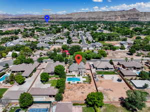 Aerial view of residential area with a pool and mountains