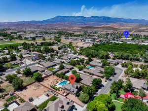 Aerial perspective of suburban area featuring a mountain backdrop