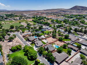 Aerial perspective of suburban area with a mountainous background