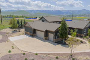 View from above of property with a mountain backdrop