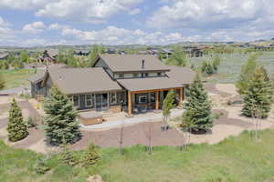 Back of property featuring a patio and a residential view