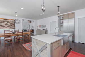 Kitchen with dark wood-style floors, open shelves, light countertops, a chandelier, and recessed lighting