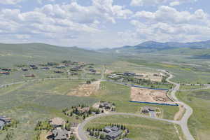 Overview of rural landscape featuring a mountain backdrop