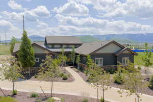 Craftsman house featuring stone siding and a mountain view