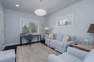 Home office featuring wood finished floors and recessed lighting