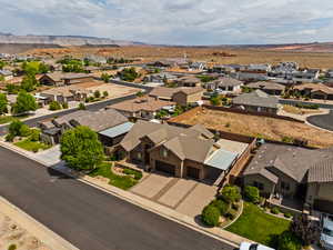 Aerial view of residential area featuring a mountainous background