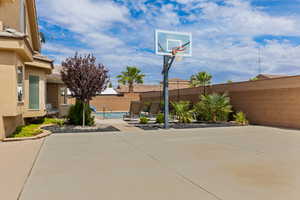 View of sport court with a fenced backyard