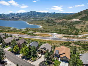Aerial perspective of suburban area featuring a water and mountain view