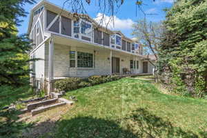View of front of property with a front yard and a porch