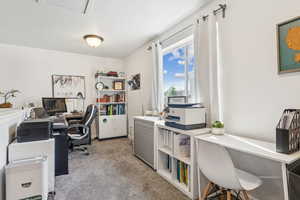 Office area featuring light colored carpet