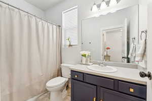 Bathroom with vanity and a shower with curtain