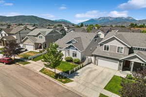 Aerial perspective of suburban area featuring a mountainous background